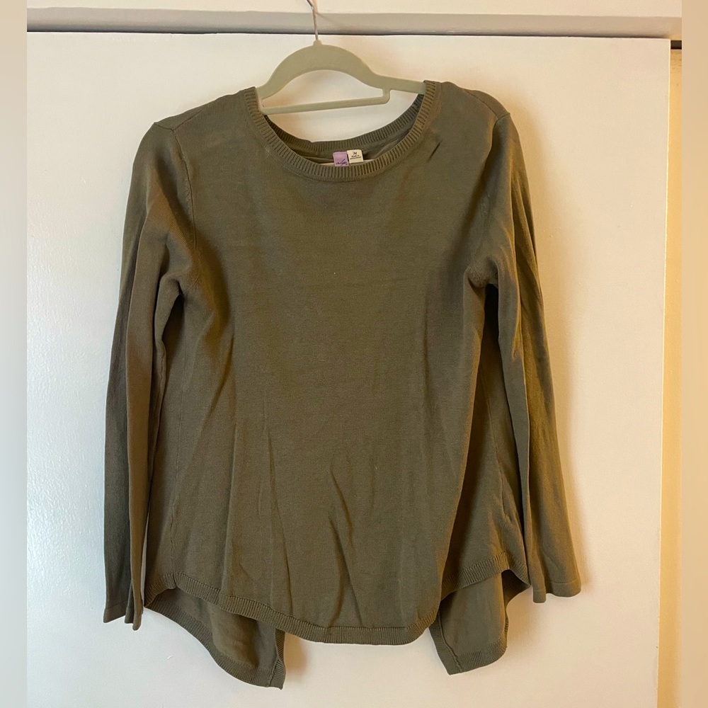 Army green sweater with open back.
